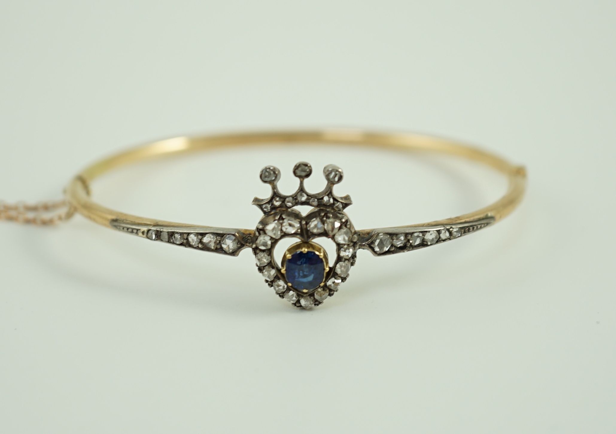 A 19th century gold, sapphire and rose cut diamond set hinged bangle